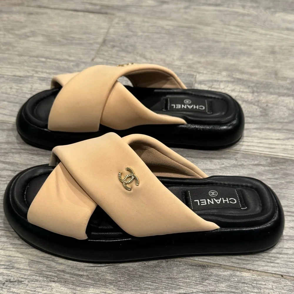 Chanel beige black Rev criss cross puffy CC logo slide sandals